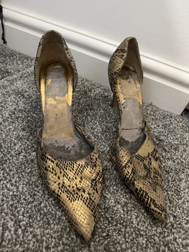 Worn high heels - worn,