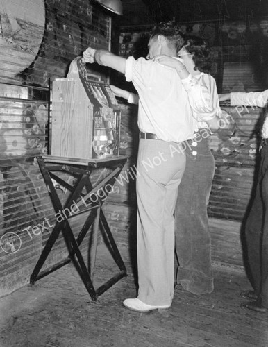 1938 couple playing slot - couple,