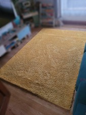 Dunelm soft gold yellow rug -