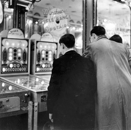 Two people looking - , at