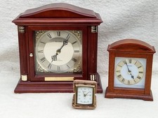 3 clocks, Swiza 8 days travel clock, Bulova and Seiko quartz clocks.