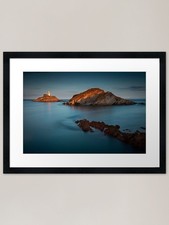 Mumbles Lighthouse at dusk