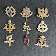 Nine Army Cap Badges