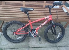 childs bike, hardly used. red in colour, apollo outrage. 