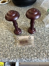 Pair of wooden holdbacks with fittings. Mahogany colour 