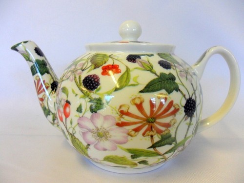 Cup teapot in hedgerow - a,