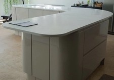 Curved Symphony Gallery New York island in cashmere with minerva  worktop