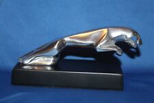 REPLICA JAGUAR CAR MASCOT ON BLACK WOODEN PLINTH