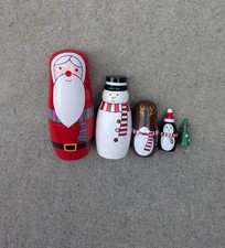 Set of five Christmas themed Russian"Matryoshka" style nesting wooden dolls.