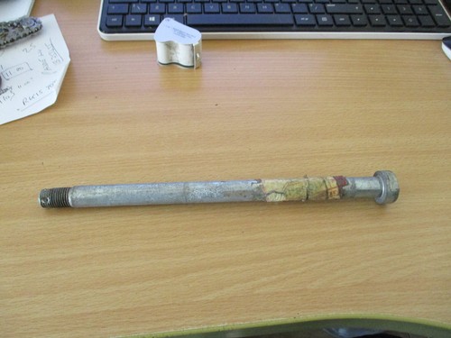 Kawasaki front wheel spindle - front,