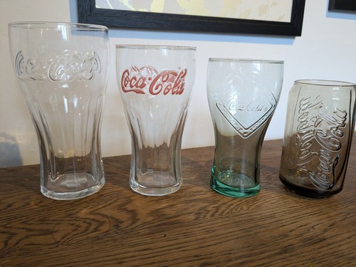 Assorted coca cola - 4, drinking