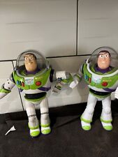 Two talking Buzz lightyear figures . ***One has the front of his helmet missing