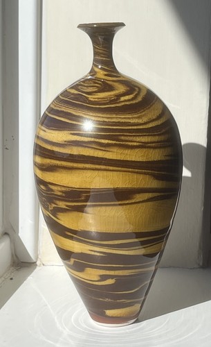 Hand thrown agateware vase - hand,