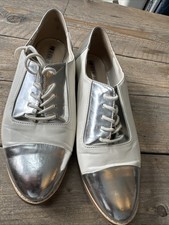 Ladies Lace Up flat shoes by Henry Holland. Cream and silver size 6