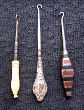 Three vintage button hooks early 20th century celluloid and silver plated (AAD)