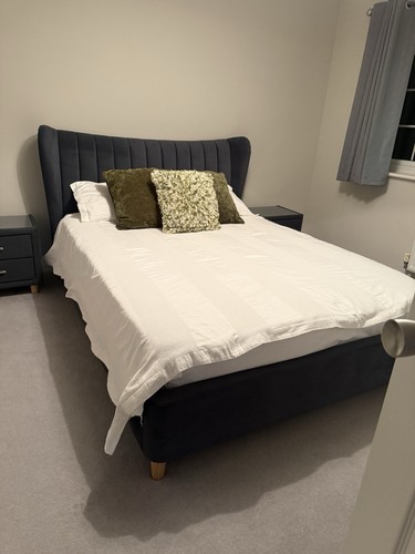 Upholstered bed frame with