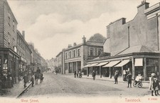 West Street, Tavistock, Devon with lots of people, shops postcard