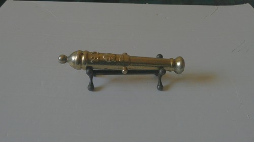 Brass cannon mounted a - brass,