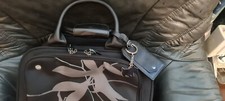 Radley 2 wheels pull along bag