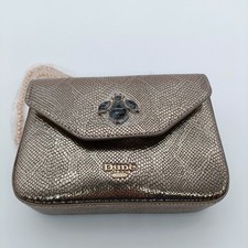 Dune Gold Metallic Clutch bag