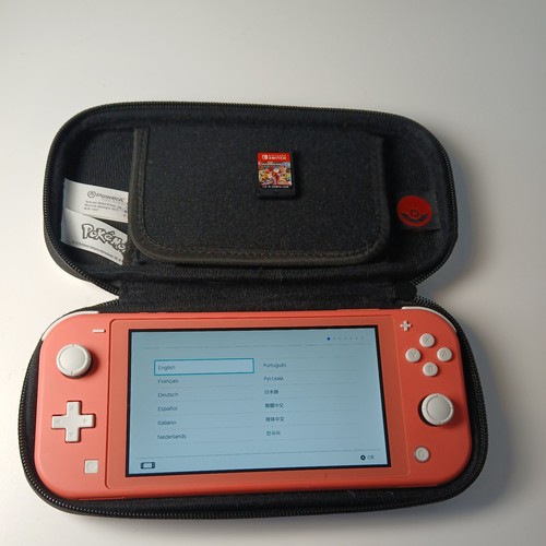 Nintendo switch lite coral - nintendo,
