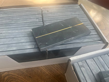 Black marble tiles with brass