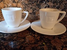 2 Nespresso coffee cups and