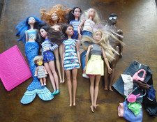 A LARGE bundle of barbie dolls
