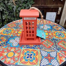 Red telephone box bird feeder