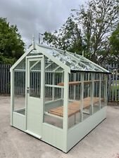 Timber Greenhouse, Painted Light Green, Installed on Customers Level Base.