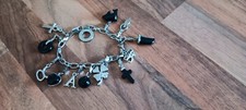 Charmology Silver Tone Bracelet With 12 Black & Silver Tone Charms - VGC
