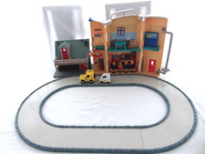 FIREMAN SAM RESCUE CENTER, MOUNTAIN LODGE, ROADWAY AND 5 FIGURES.
