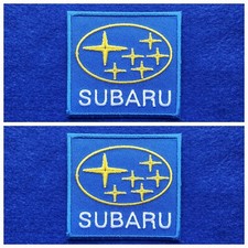 A Pair Of Motor Car Racing