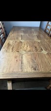 solid oak dining table and 8 chairs