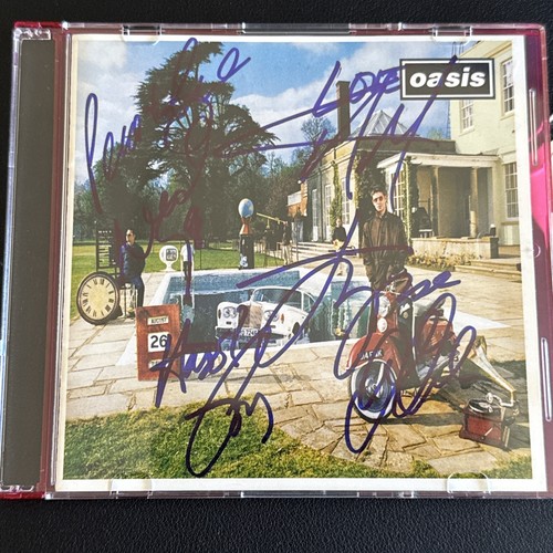 Oasis autographed here - cd,