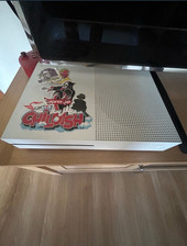 Microsoft Xbox One S with games and charging dock