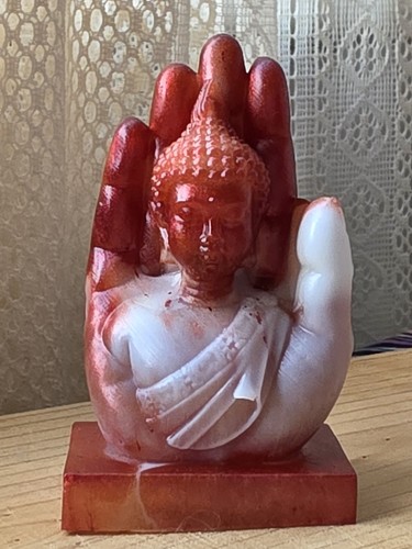 Handmade buddha in hand - in,
