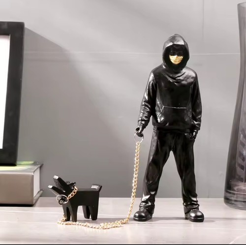 The man leading dog sculpture - man,