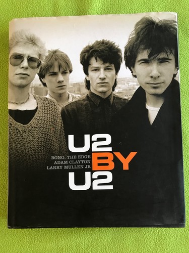U2 hardback - by,