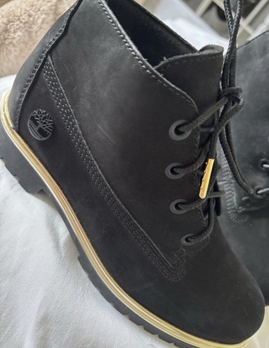 Black and gold timberland - and,