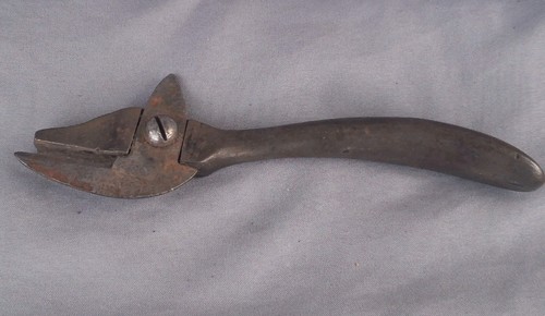 Antique metal can opener - metal,