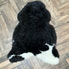 Curly Sheepskin Rug Black with White Side Patches 100% Natural Undyed 112x77cm