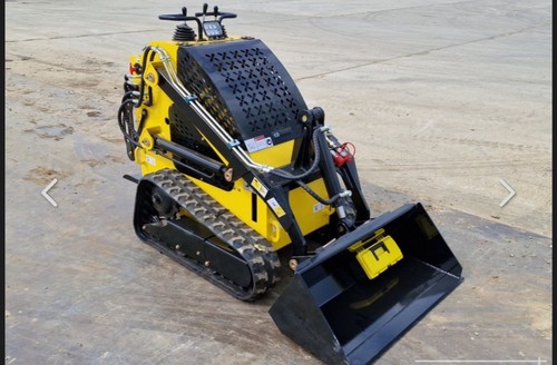 Mini skidsteer delano - ),