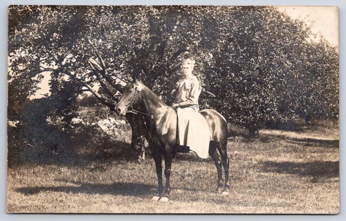 Antique young woman riding - antique, in