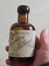 SPLIT SIZE DUMPY SELTZER BOTTLE WITH ITS ORIGINAL LABEL&CONTENTS FIRTH ,IN MINT.