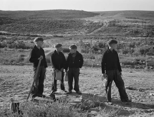 Boys wait for - bus, in