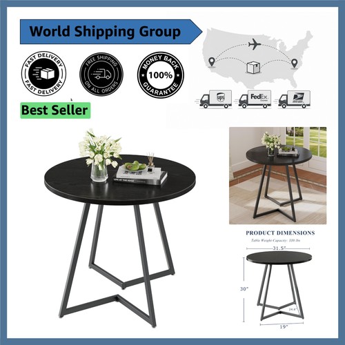 Sleek black round dining table - dining,