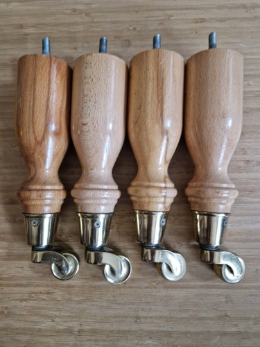 Turned wood brass castor - turned,