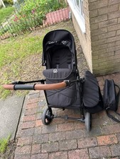 Black Puggle Pram with Rain