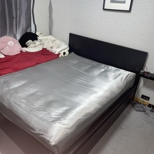 Black Ikea Malm king-sized bedframe with slats and two under-bed drawers